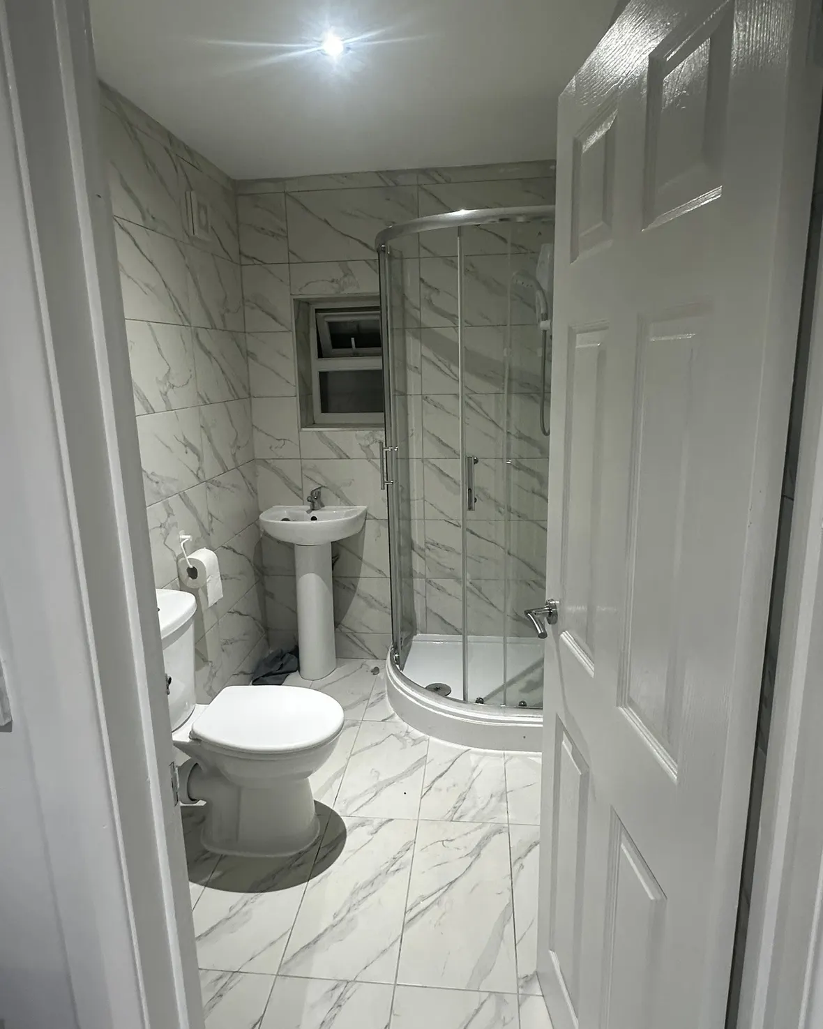 Completed bathroom renovation with marble-effect tiles and quadrant shower enclosure, Southall, Ealing, London