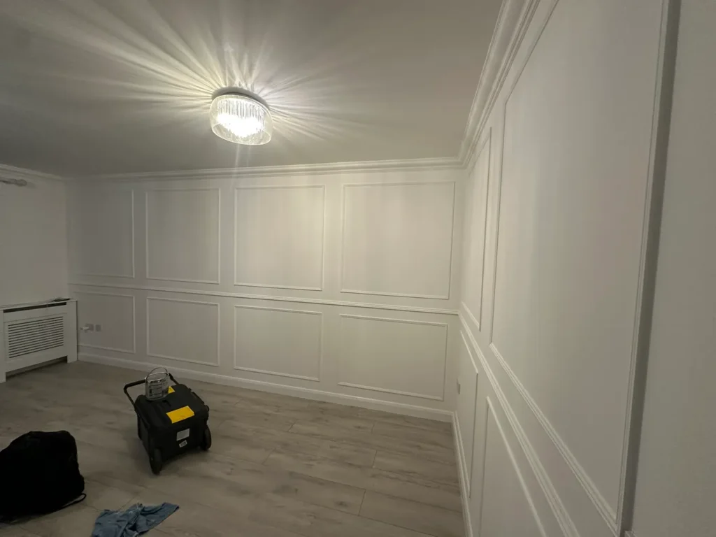 December 2025: a room finished with wall panelling and new flooring, Addlestone
