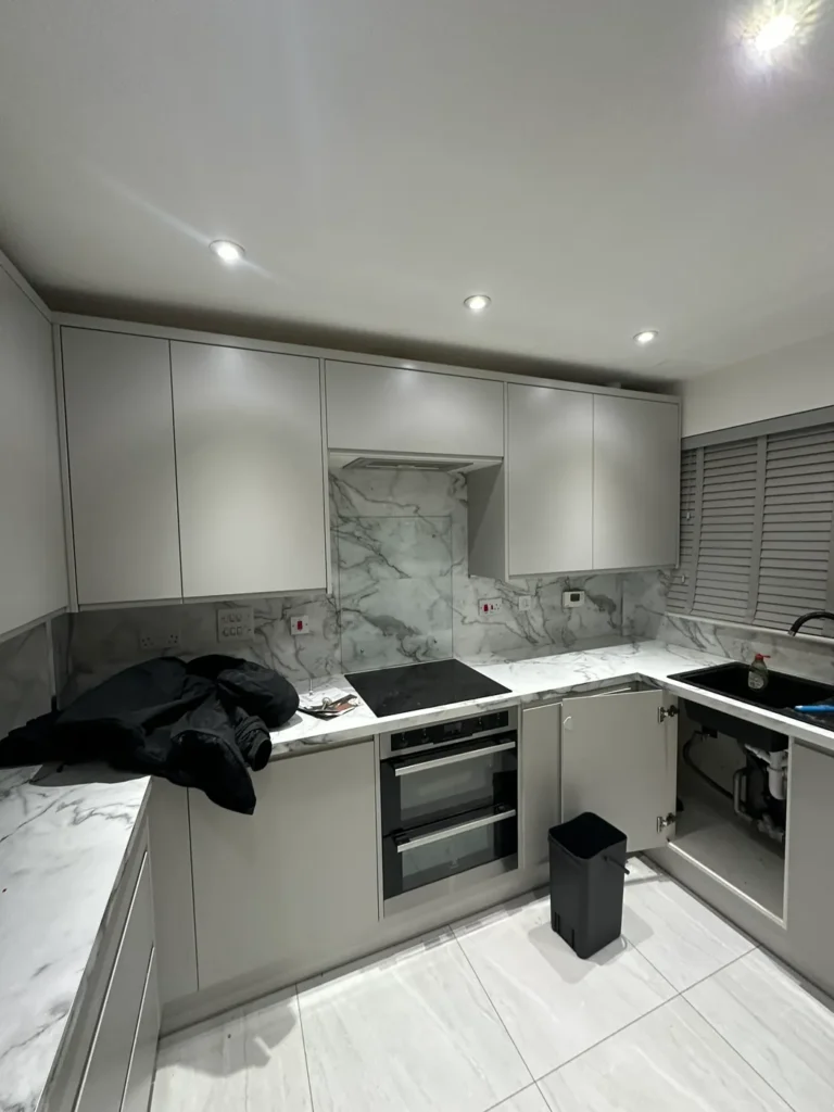 A new grey kitchen with a marble-effect splashback, Addlestone
