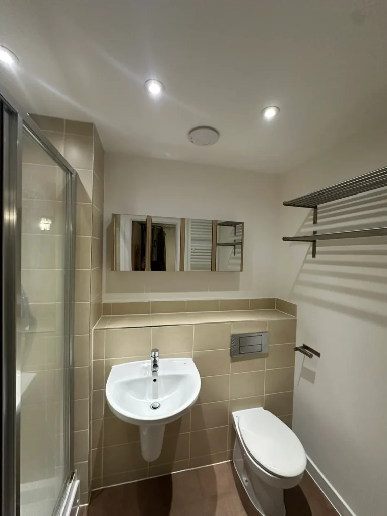 A cloakroom with a wall-hung basin, Addlestone