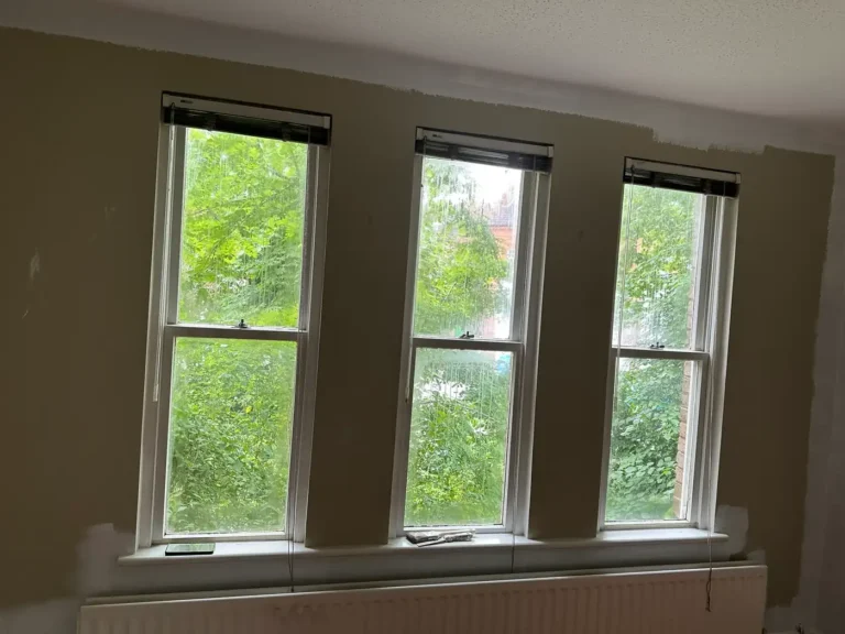 June 2025: the first coat going on around the sash windows, Brockley