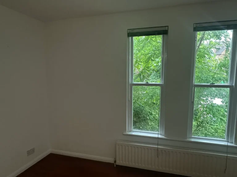 Walls, ceiling and woodwork finished around the windows, Brockley