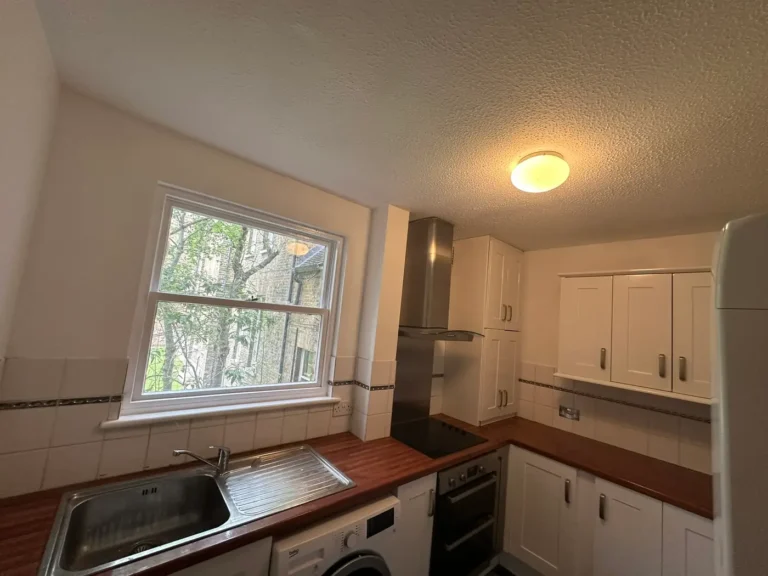 The kitchen walls and ceiling repainted, Brockley