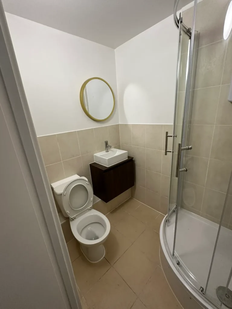 The shower room finished with a round mirror, Deptford