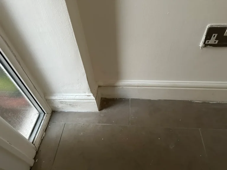 January 2025: new skirting and finishing work by a door, Epsom