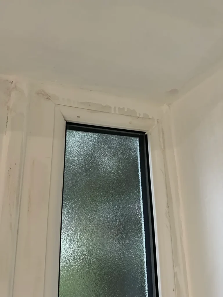 A window reveal being decorated, Epsom