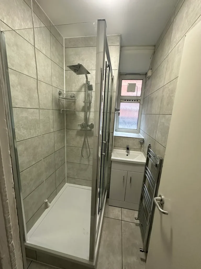 The shower enclosure and towel rail, King's Park, Hackney