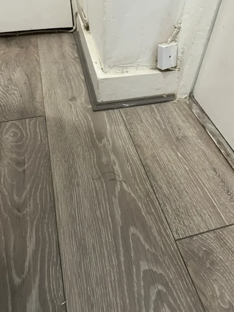 New wood-effect flooring fitted the following week, King's Park, Hackney