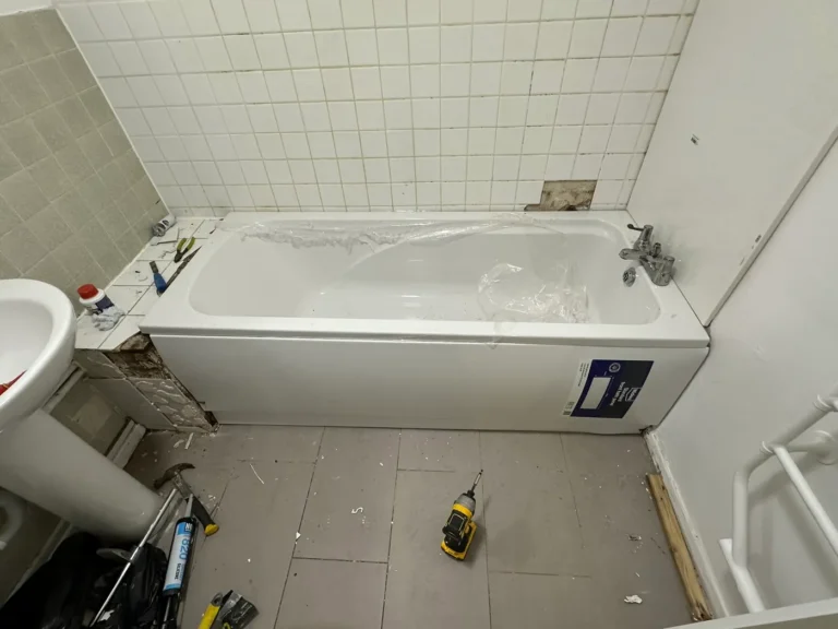The bath being boxed in and connected, Harrow Weald