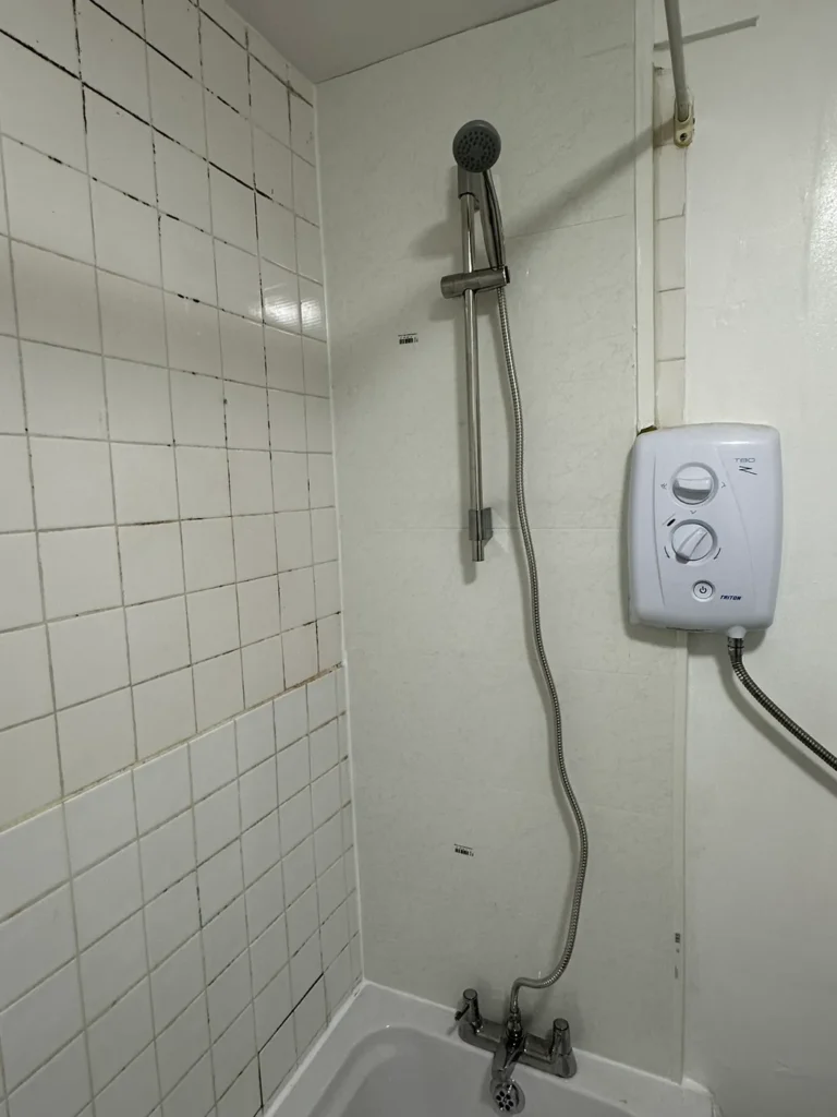 A new electric shower over the bath, Harrow Weald