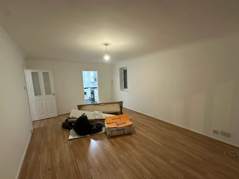 The living room with new wood-effect flooring and fresh paint, Harrow Weald