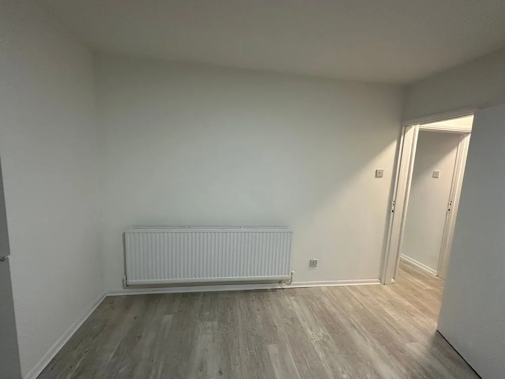 Renovated bedroom with a white panel radiator, new flooring and freshly painted walls, Sidcup