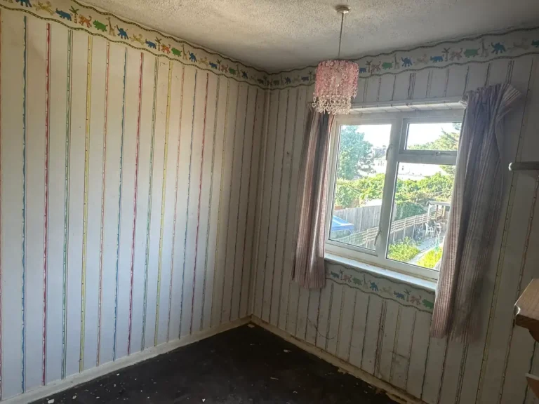 A bedroom before the strip-out, with striped wallpaper and a border, Blendon, Sidcup