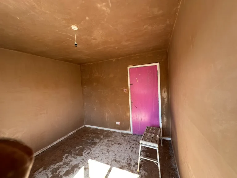 New plaster drying across walls and ceiling, Wexham Court, Slough