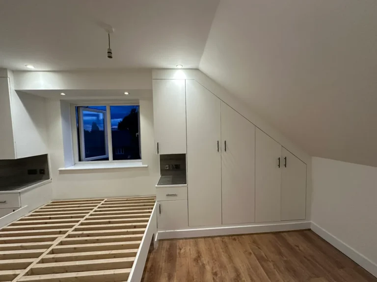Fitted storage built into the sloping ceiling, Wexham Court, Slough