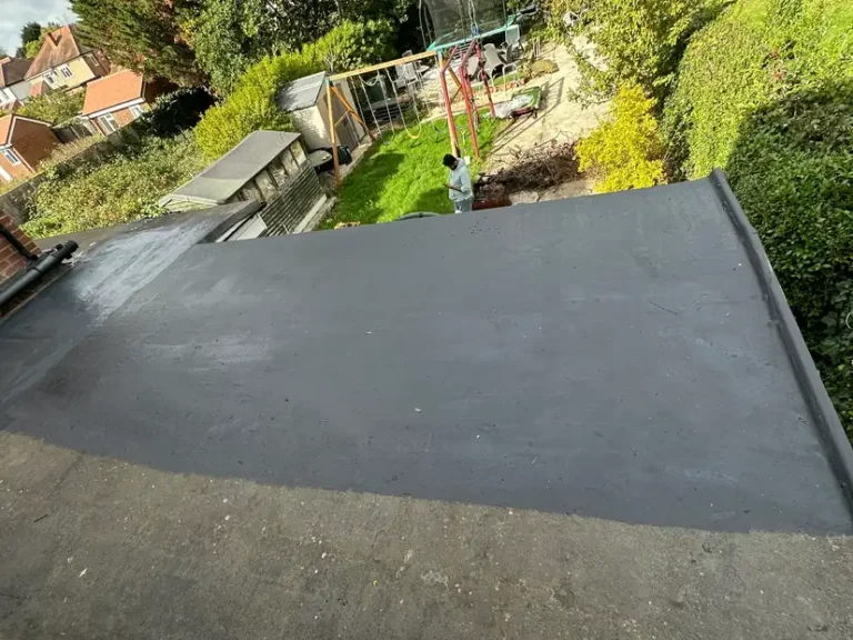 October 2025: a flat roof with its new waterproof coating going on, Sudbury, Wembley