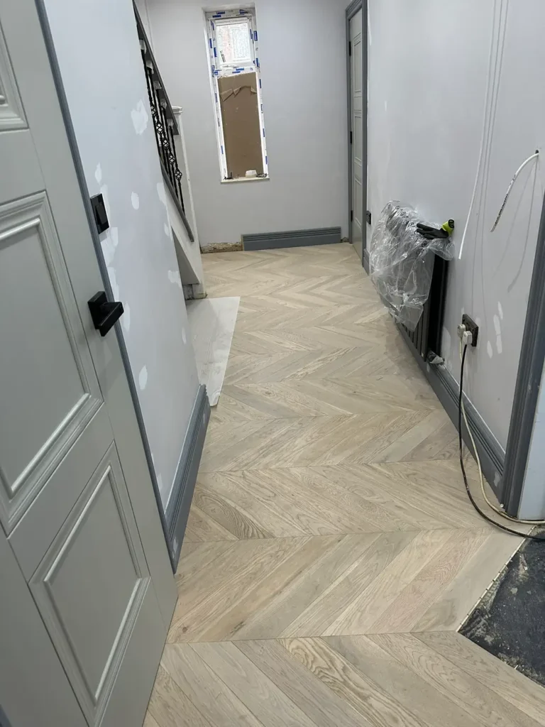 February 2024: chevron flooring going down in the hallway, Stanborough, Watford