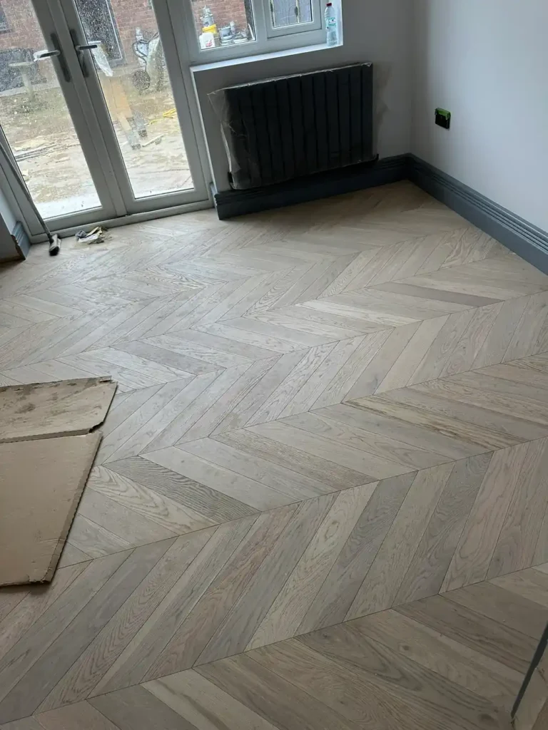 Chevron flooring laid through the rear room to the garden doors, Stanborough, Watford