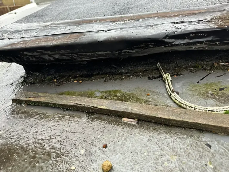 January 2026: the roof edge had lifted, with rotten timber exposed underneath, Wealdstone