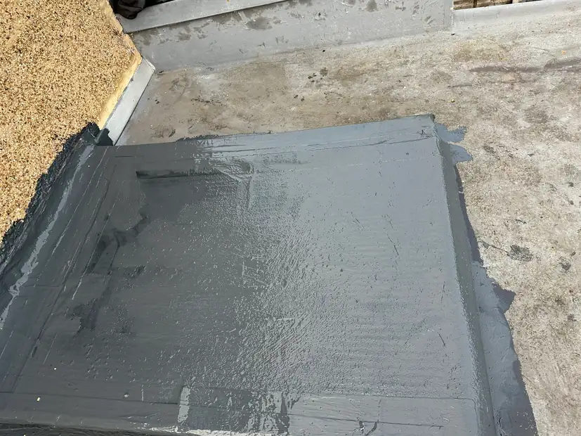 The same flat roof edge rebuilt and sealed with a reinforced liquid membrane, Wealdstone, Harrow