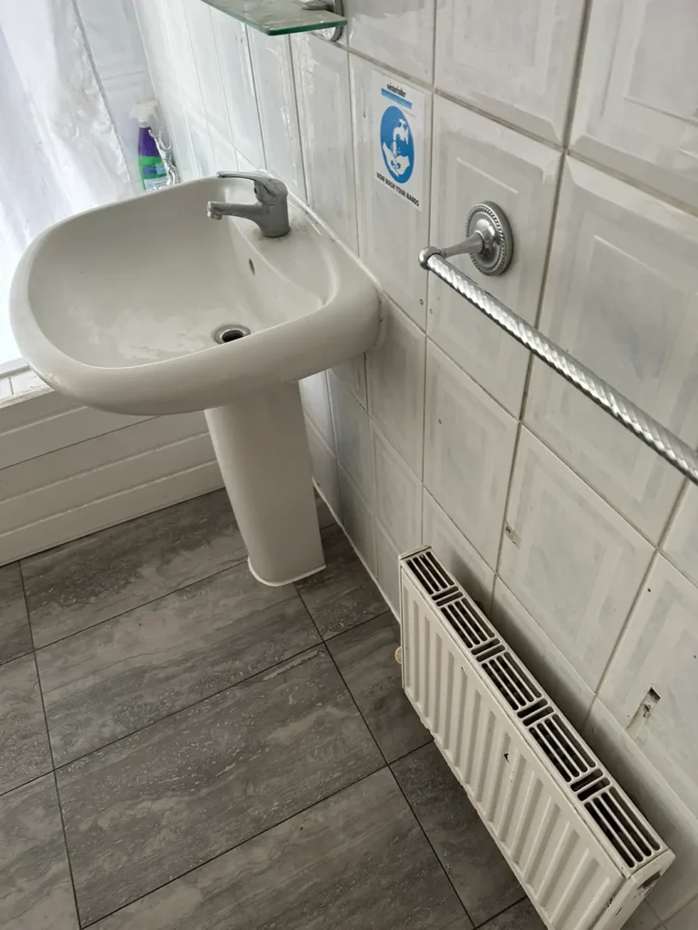 The new floor around the basin and radiator, Wembley Hill, Wembley