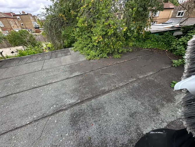 July 2025: the flat roof before any work, weathered and patched, Wembley Central