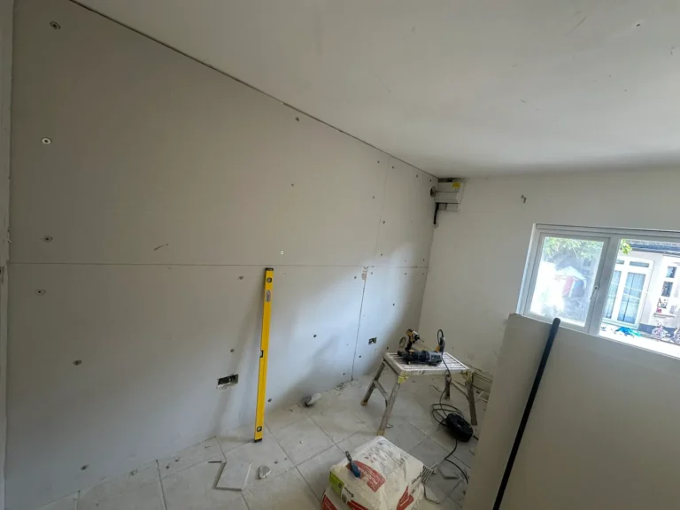 Plasterboard fixed over the insulation, ready for skimming, Wembley Central