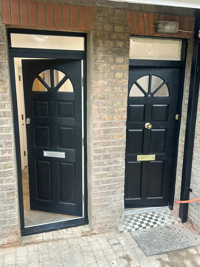 Two front doors side by side, both repainted, with a new tiled step, Walpole, West Ealing