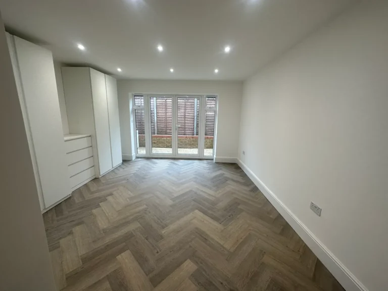 Fitted storage and herringbone flooring in the rear room, Walpole, West Ealing