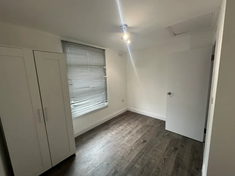 A bedroom with new flooring and a fitted wardrobe, Woolwich Common, Woolwich